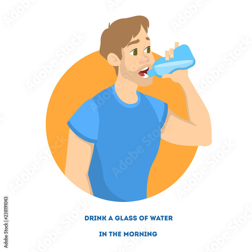 Young man holding a bottle of fresh cold water