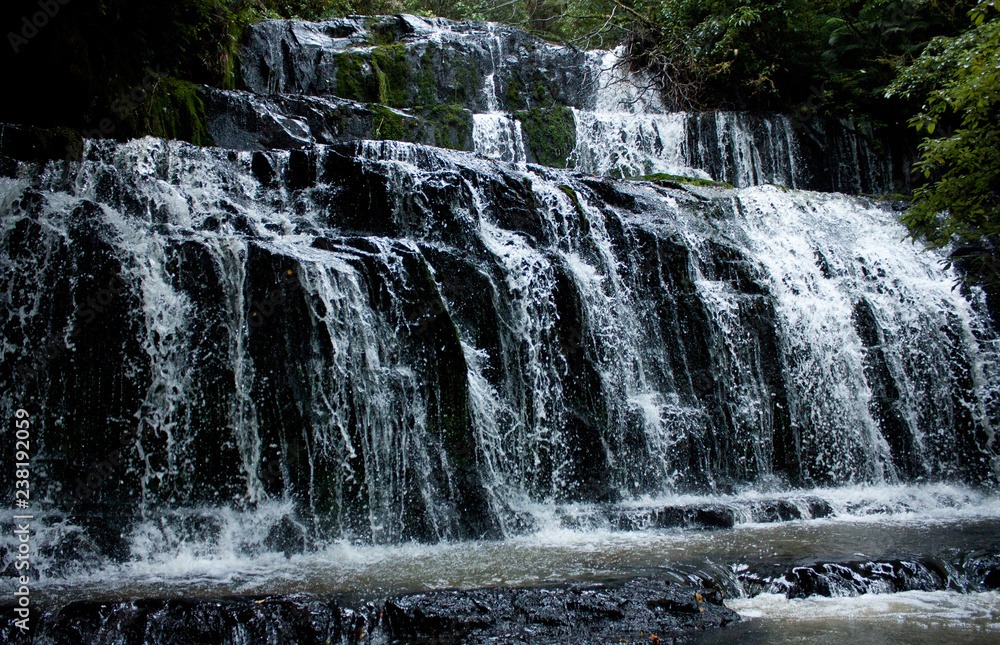Fototapeta premium Flowing Purakaunui Falls in the Catlins in the South Island in New Zealand