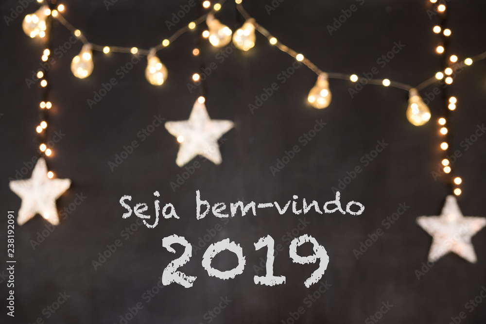 Seja bem-vindo in portuguese means Welcome in a black background with blurred lights and stars.
