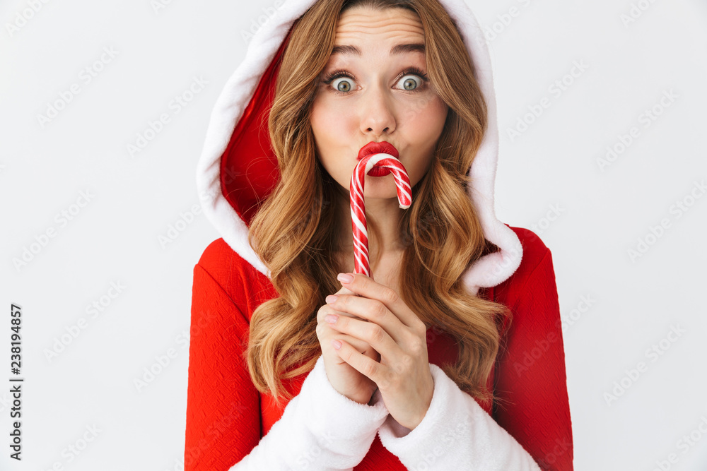 Cheerful young girl wearing Christmas dress Cheerful young girl wearing Christmas dress