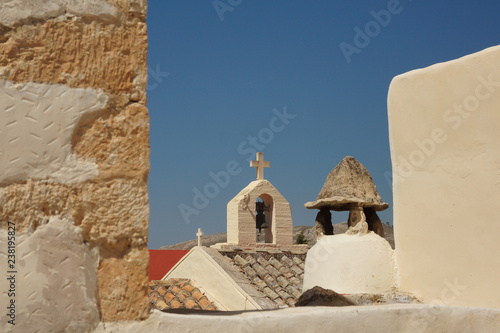 The crosses on the bell towers of some Greek churches