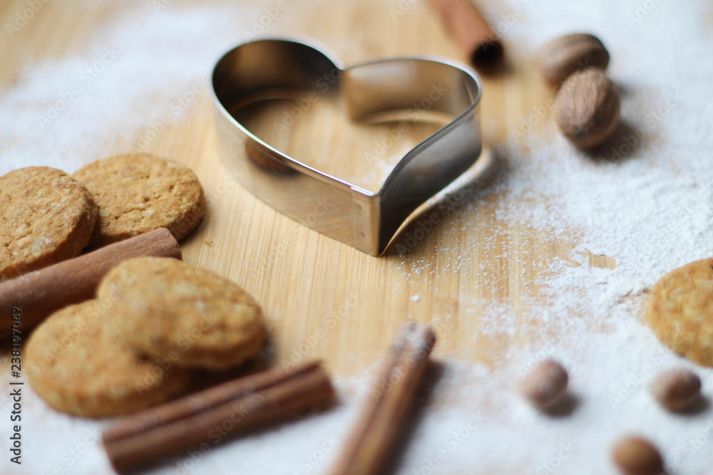Great Cookies. Heart biscuit cutter bake tool on white and wooden background. Christmas concept. Template Great Cookies. Heart biscuit cutter bake tool on white and wooden background. Christmas concept. Template