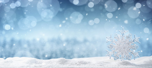 Winter background, crystal snowflake in the snow with copy space