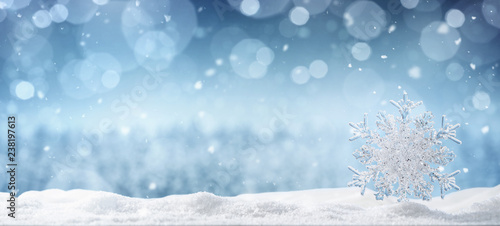 Winter background, crystal snowflake in the snow with copy space