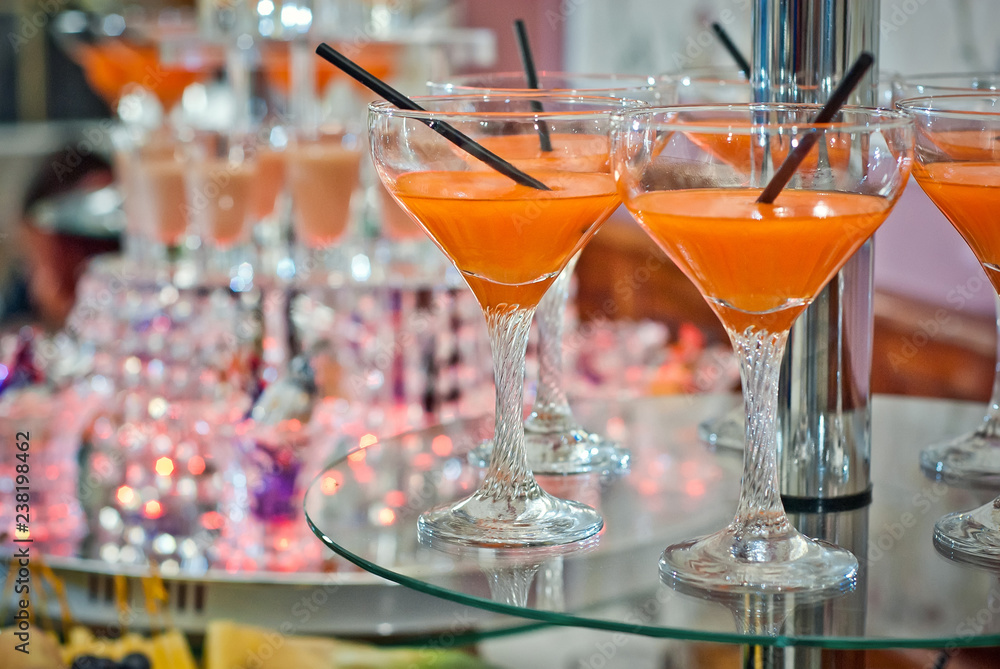 Glass glasses with colored drinks on the table. alcoholic drinks at the buffet Glass glasses with colored drinks on the table. alcoholic drinks at the buffet