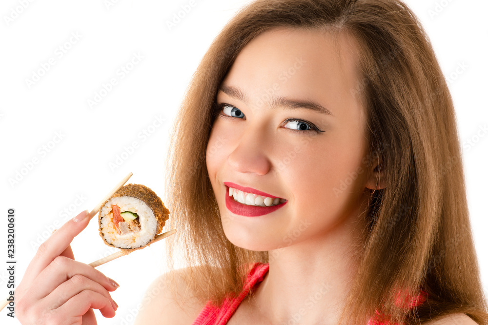 young smiling girl with sushi roll in hand young smiling girl with sushi roll in hand