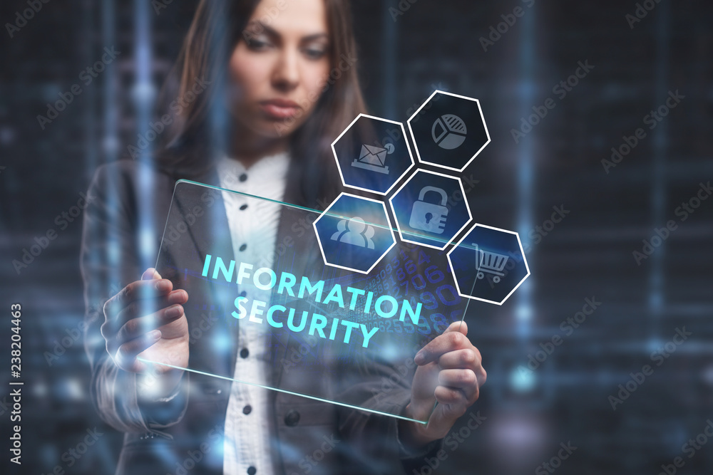 The concept of business, technology, the Internet and the network. A young entrepreneur working on a virtual screen of the future and sees the inscription: Information security The concept of business, technology, the Internet and the network. A young entrepreneur working on a virtual screen of the future and sees the inscription: Information security