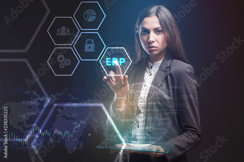 The concept of business, technology, the Internet and the network. A young entrepreneur working on a virtual screen of the future and sees the inscription: ERP