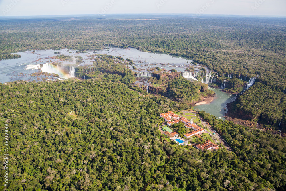 Aerial bird's-eye view panorama of Iguazu Falls from above, from a helicopter. Border of Brazil and Argentina. National park. Iguassu. Parana State.
