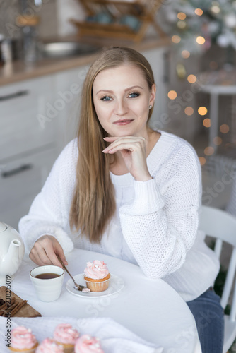 Portrait of a girl sitting at the table.