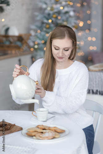 Portrait of a girl pouring tea.