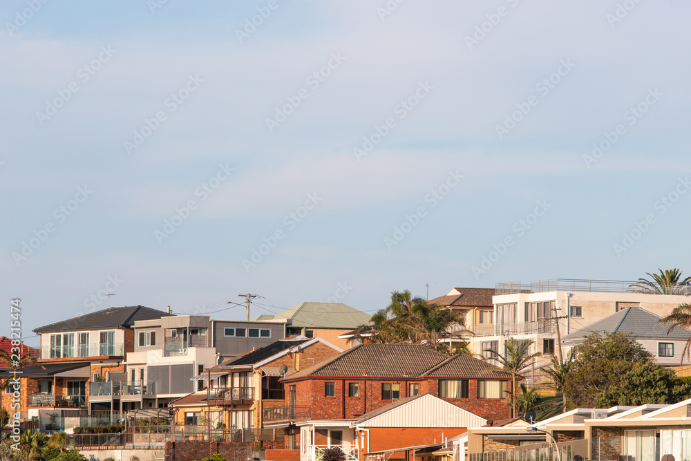 Dense housing view with blue sky.
