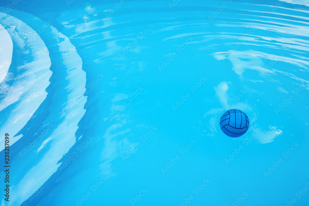Blue ball and circles on water in blue pool Blue ball and circles on water in blue pool