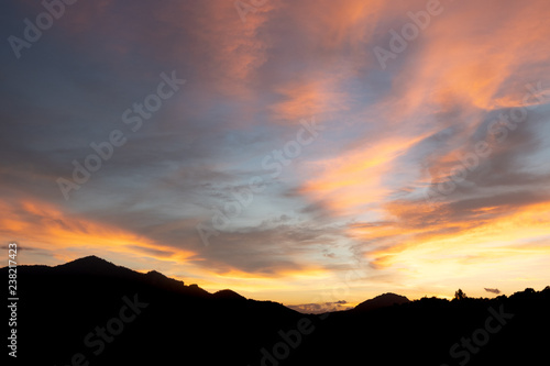 Beautiful sunset with mountains covered with orange horizon in Mae Sot, Thailand.