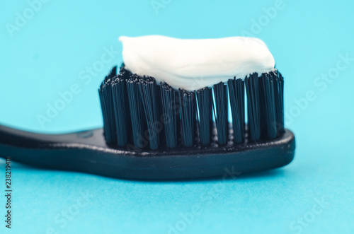 Toothbrushes on blue background. Copy space for text