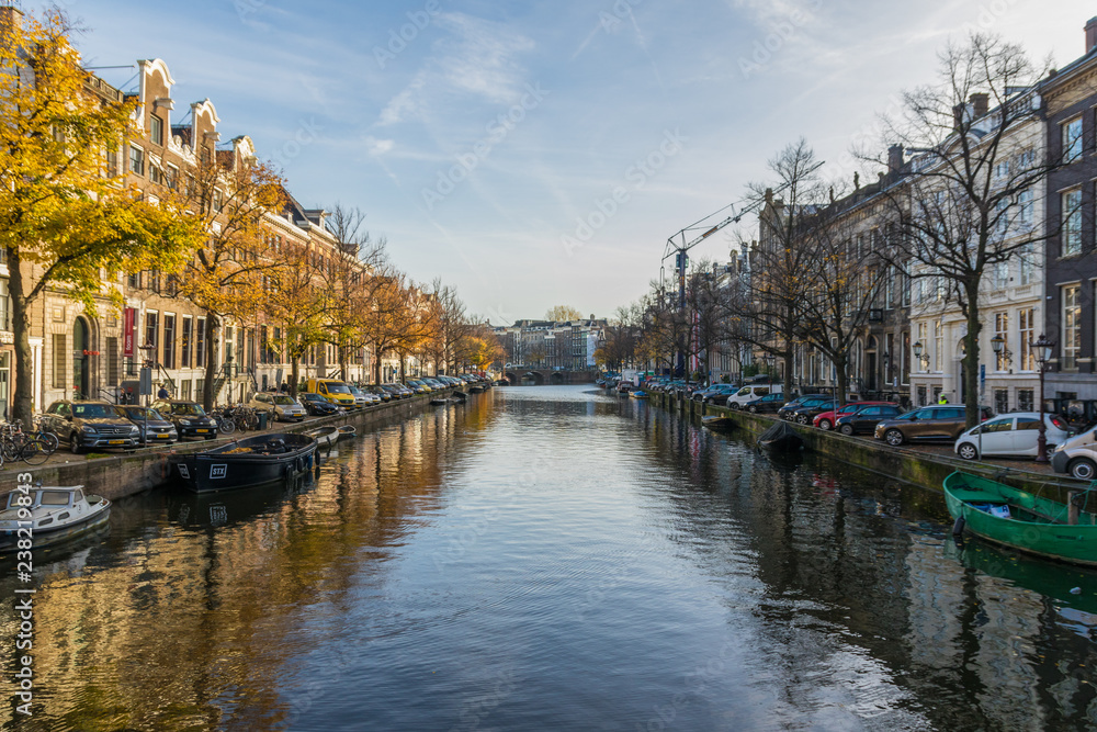 Fototapeta premium Amsterdam, Netherlands - main city and capital of the country, Amsterdam offers a splendid display of history and modernity, surrounded by the unique view of its canals