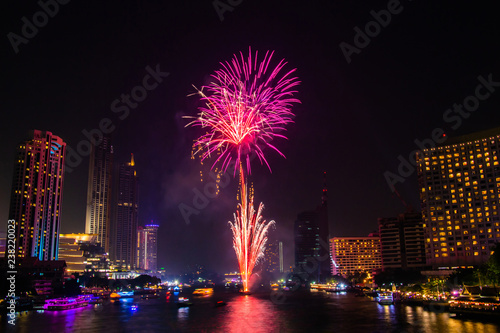Firework colourful on night city view background for celebration festival.
