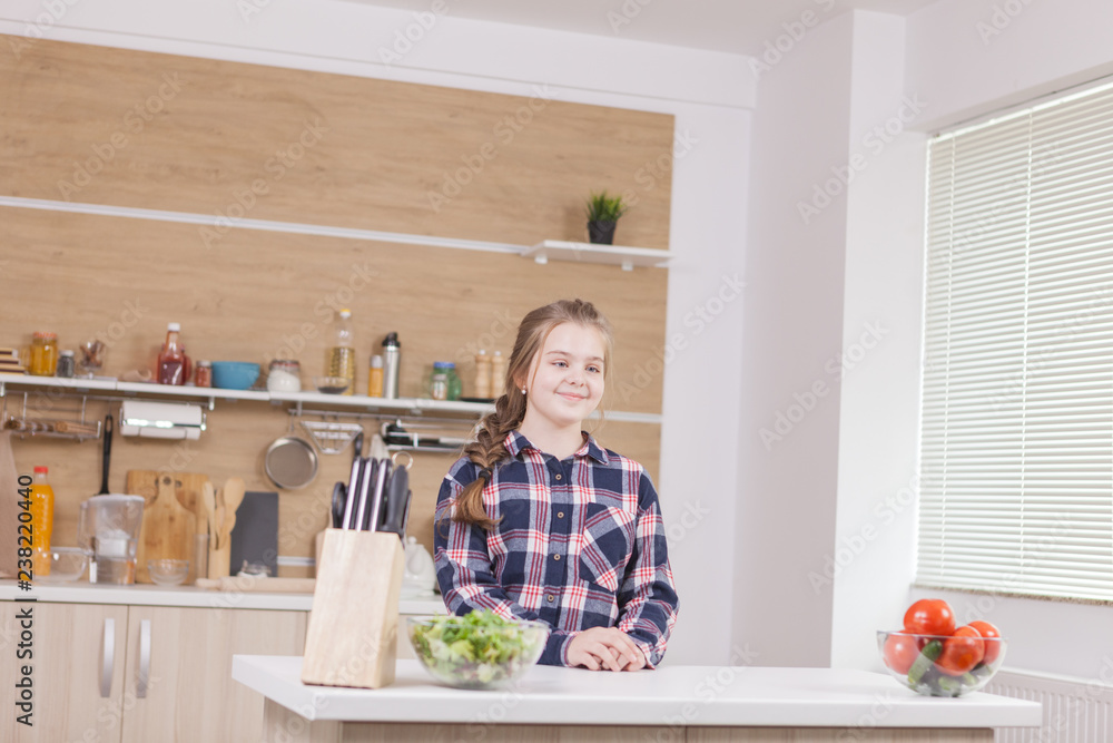Beautiful little girl smiling while cooking. Food preparing. Beautiful little girl smiling while cooking. Food preparing.