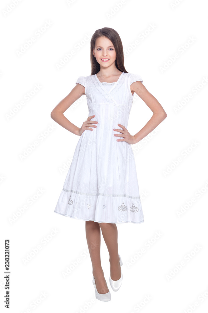 Portrait of beautiful girl in white dress posing on white background