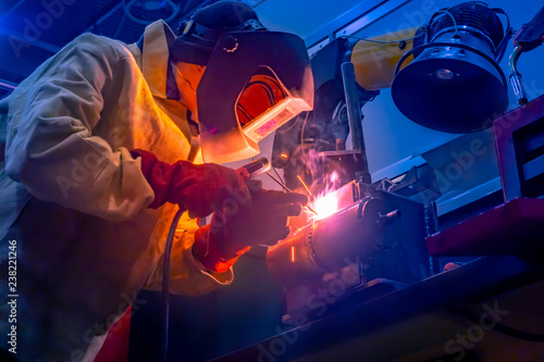 Welder. The man does the wo...