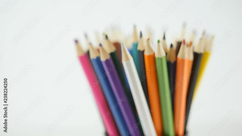 Pencil on a white background. Camera in motion. Pencils are in the glass Pencil on a white background. Camera in motion. Pencils are in the glass