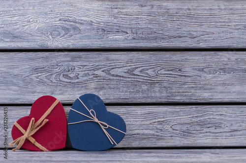 Red and blue heart-shaped goft boxes. Valentines Day background with colored boxes in a shape of heart. Romantic holiday greeting card. photo