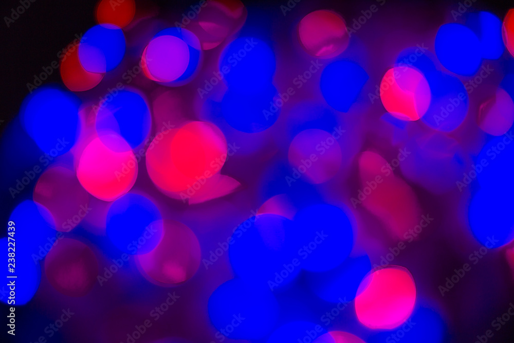 Christmas background with warm colored lights and copy space. Background with christmas lights. Christmas garland. New Year.