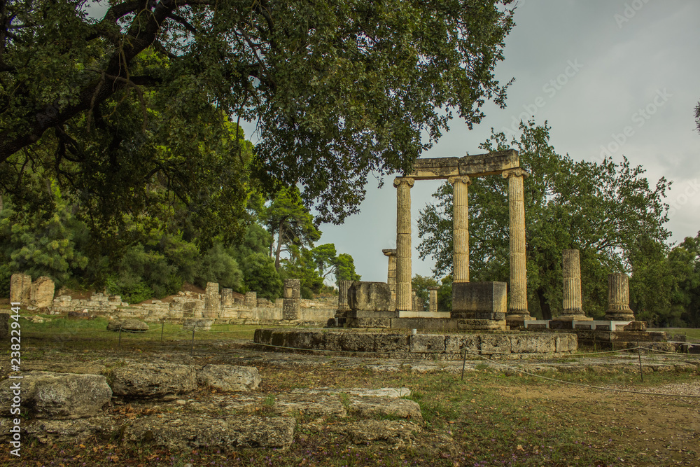 antique marble colonnade ruins of ancient temple of destroyed city in park outdoor environment, sightseeing and excursion tourist concept