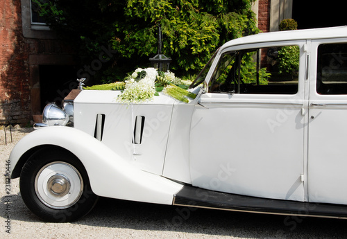 White old-timer car outdoor decorated for a wedding
