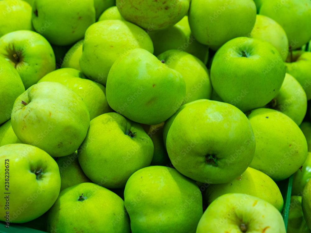 Bunch of green and red apples on boxes in supermarket. Bunch of green and red apples on boxes in supermarket.