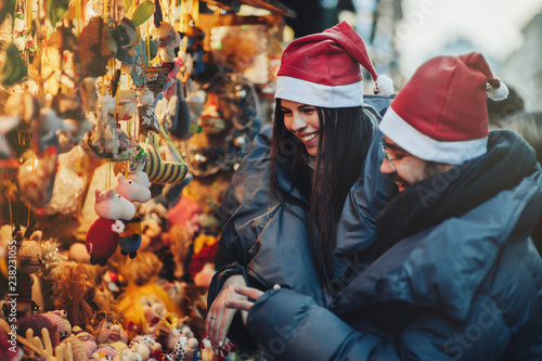 Young romantic couple is having fun outdoors in winter before Ch 