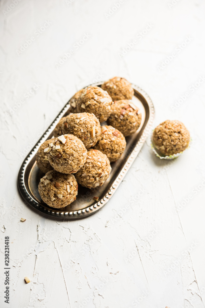 Oats laddu or Ladoo also known as Protein Energy balls. served in a plate or bowl. selective focus Oats laddu or Ladoo also known as Protein Energy balls. served in a plate or bowl. selective focus