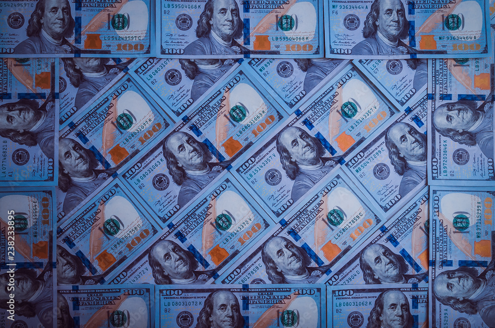 The background of a hundred dollar bills. Blue design.