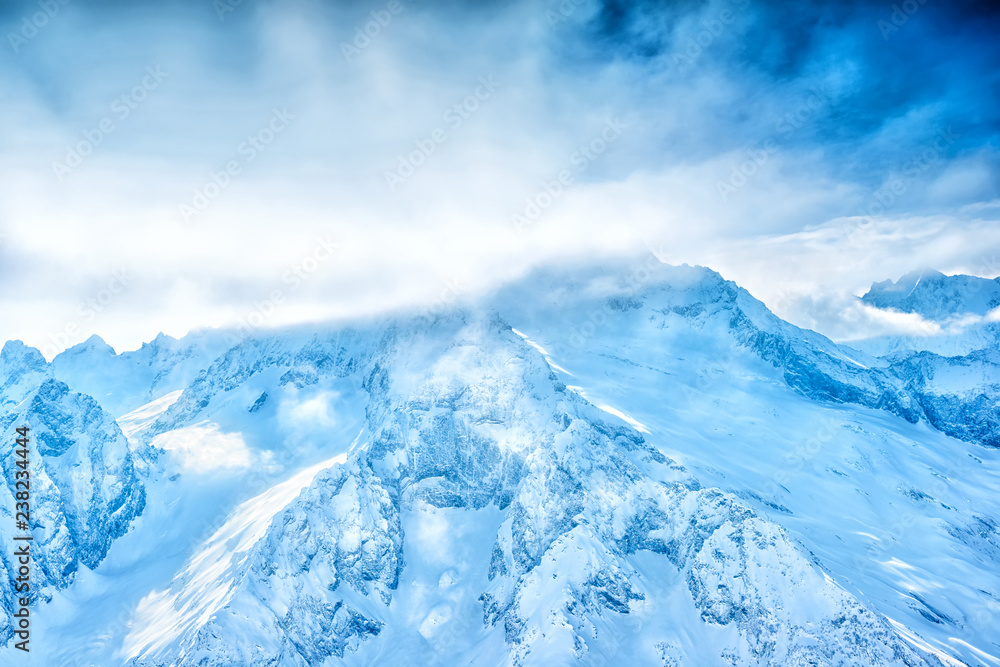Fototapeta premium scenery of winter sunny day of high Dombaj mountains in National Park, Russia