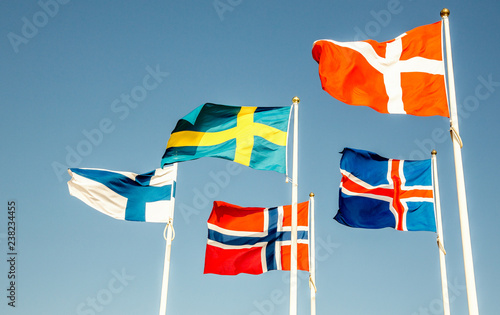 Danish, Swedish, Icelandic, Finnish and Norwegian scandinavian flags waving on the wind in Helsinborg, Sweden