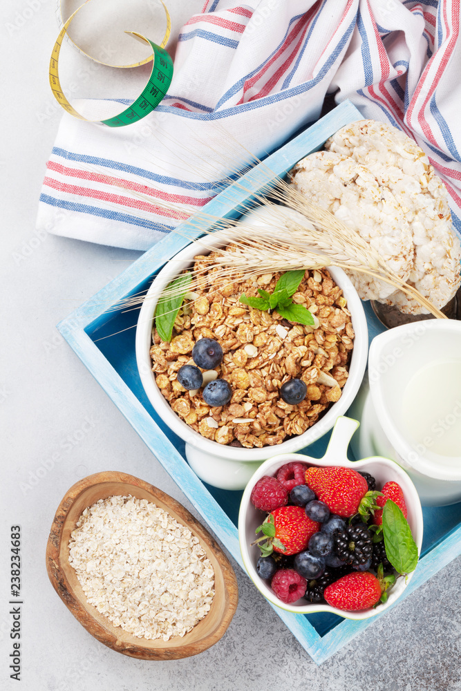 Healthy breakfast set with muesli, berries and milk Healthy breakfast set with muesli, berries and milk