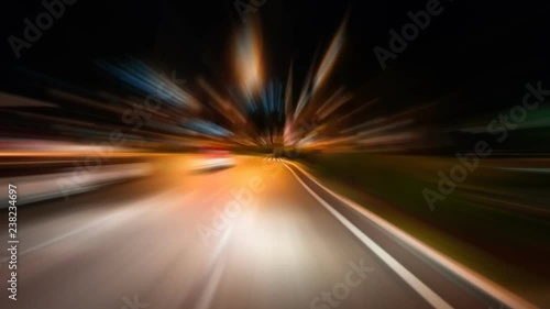 Time-Lapse night traffic with futuristic motion blur & zoom effects. On the road or streets, shoot from inside a moving car. 