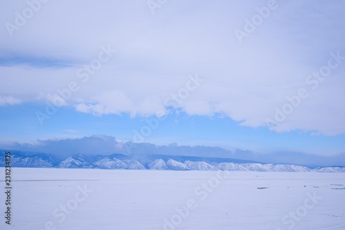 Blue mountains of lake Baikal in Siberia  in cloudy