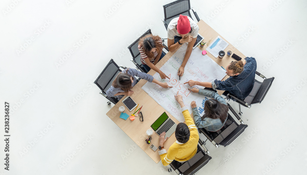 Top view scene of Asian and Multiethnic Business people with casual suit working with brainstorming and pointing to the design concept in the modern workplace, people business group concept - obrazy, fototapety, plakaty 