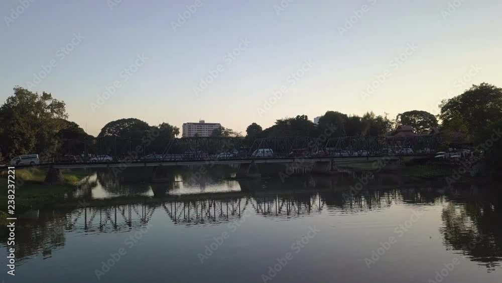 drone shot fly above a bridge in chiang mai