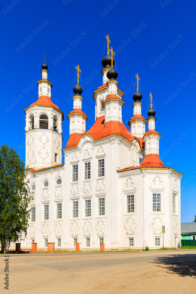 Russian white orthodox Temple of the Entry of the Lord into Jerusalem against the blue sky The Nativity Church, Totma, Russia. Architectural forms reminiscent of a ship.