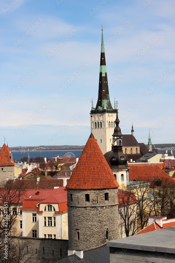 View of the towers and roofs of Old Tallinn from the fortress wall. View of the towers and roofs of Old Tallinn from the fortress wall.