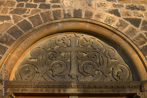 Hiddenhausen Protestant Church Stephanus.Cross fragment of architecture facade.Germany. photo