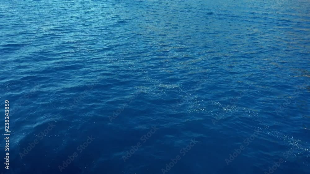 Beautiful background. Turquoise sea surface with a slight ripple. Sunny day. Beautiful background. Turquoise sea surface with a slight ripple. Sunny day.