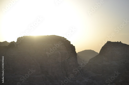 sunset in Petra, Jordan - ancient Nabatean city in red natural rock and with local bedouins, UNESCO world heritage
