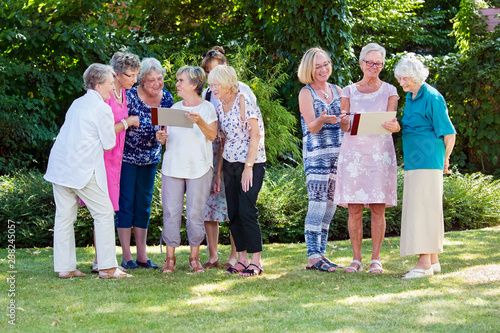 Group of elderly ladies at a care home art class. photo