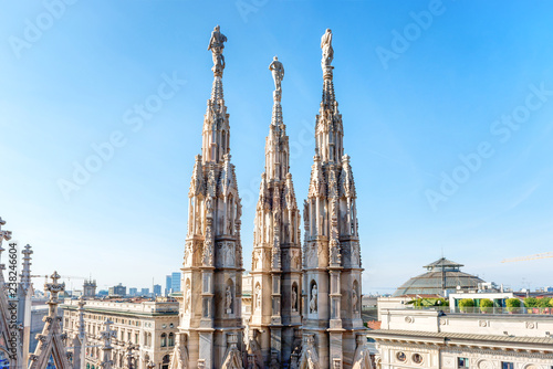 Marble statues - architecture on top of roof Duomo gothic cathedral in Milan, Italy © Pavlo Vakhrushev