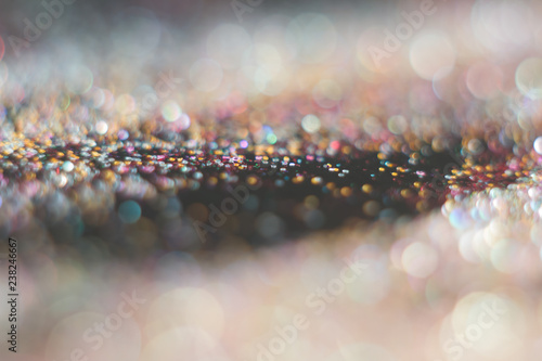 Abstraction colorful bokeh on a dark background. Defocused.