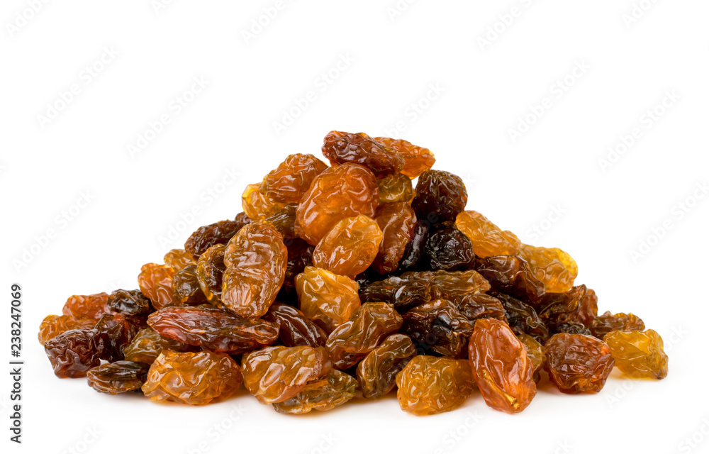 Heap of raisins closeup on a white. Isolated. Heap of raisins closeup on a white. Isolated.