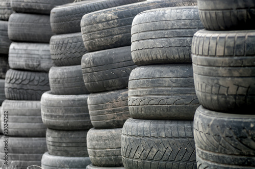 Used wheel tires stacked ready for recycling.